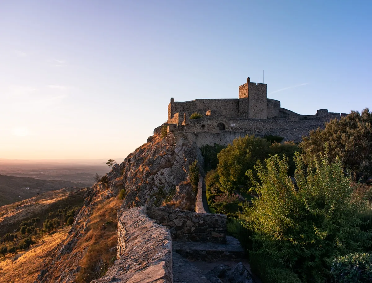 Alentejo — Marvão medieval castle glowing at golden sunset