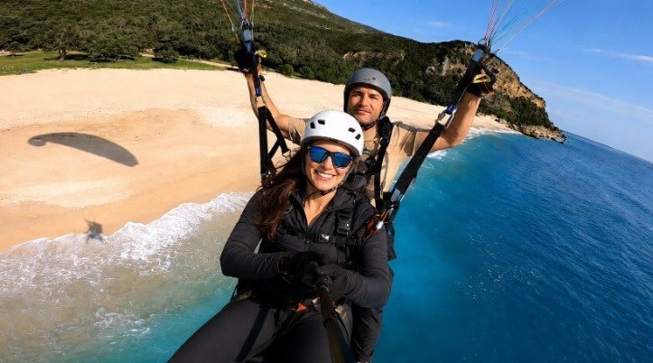 Tandem paragliding over the Atlantic coast of Sesimbra, Portugal