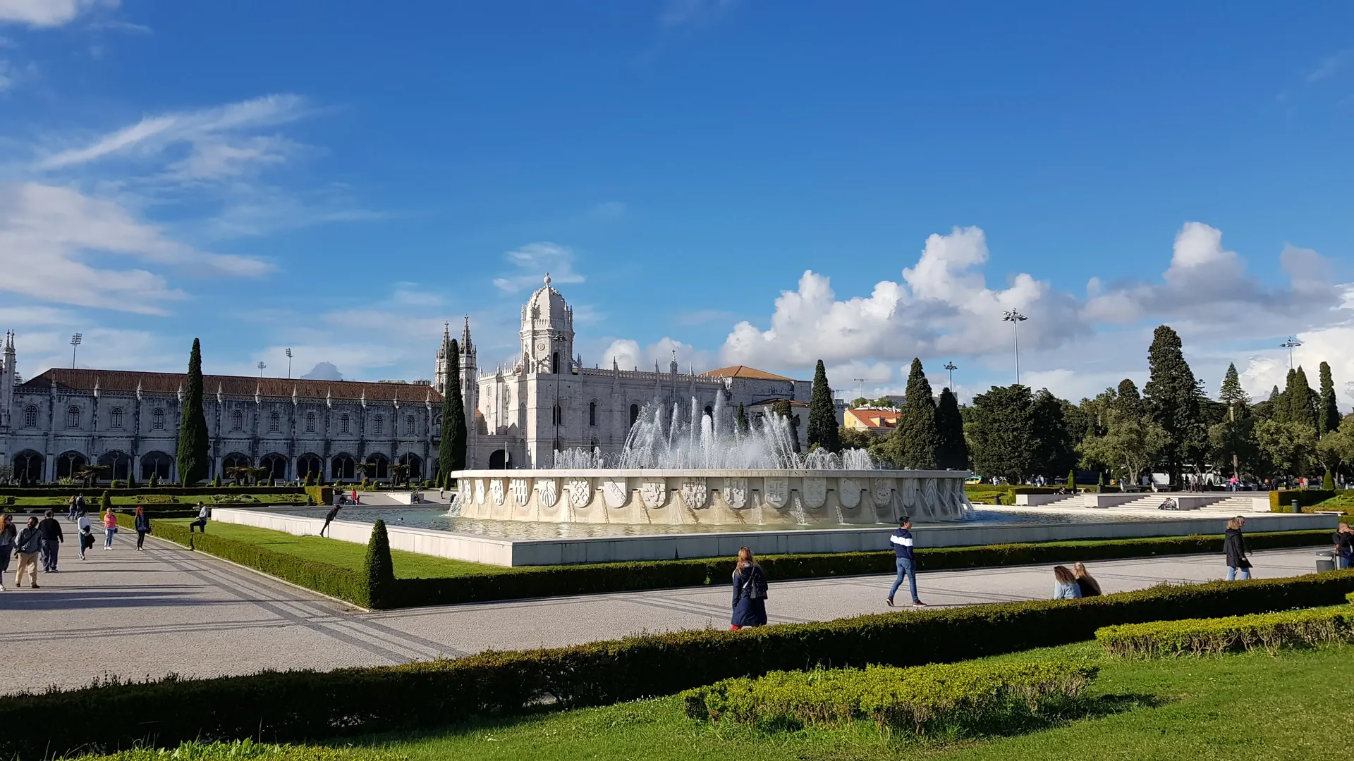 The two-storey Manueline cloisters of Jerónimos Monastery in Belém, Lisbon — intricate stone tracery, twisted rope carvings, and armillary spheres decorating the UNESCO World Heritage Gothic arches, with entry included in this private Lisbon tour