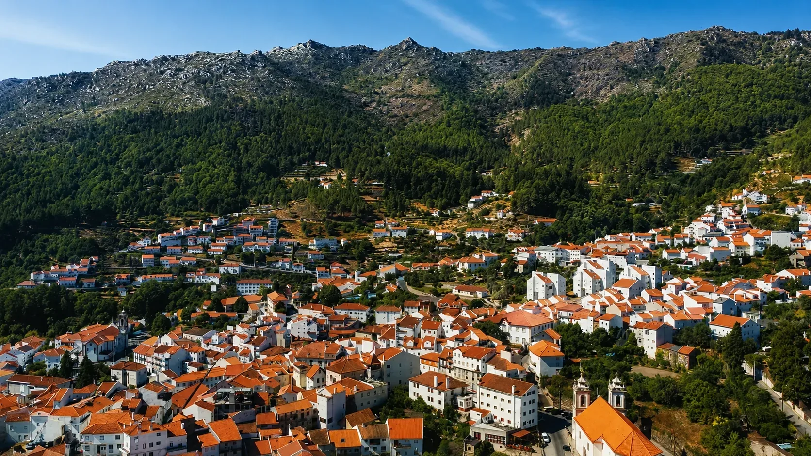 Manteigas village nestled at the bottom of the Zêzere glacial valley in Serra da Estrela Natural Park, central Portugal