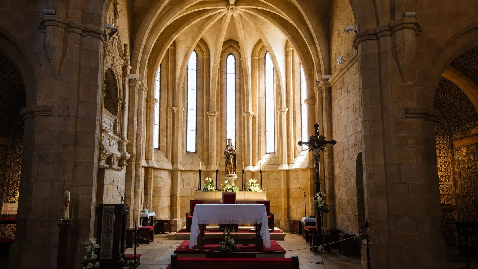 The Church of Santa Maria do Olival in Tomar — the Templar mother church and pantheon of the Grand Masters of the Order of Christ, with its Gothic portal and rose window, containing the medieval tombstones of Knights Templar Grand Masters